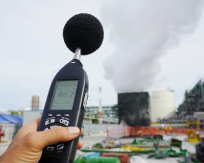 Hand of Environmental officer holding to use sound level meter f